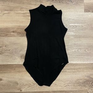 Black mock neck body suit. NWT